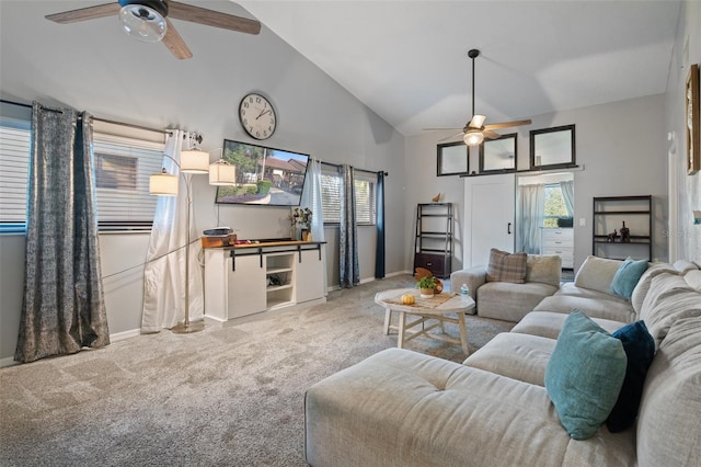 carpeted living room featuring high vaulted ceiling and ceiling fan