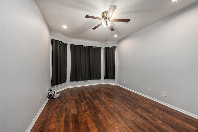 empty room featuring hardwood / wood-style floors and ceiling fan