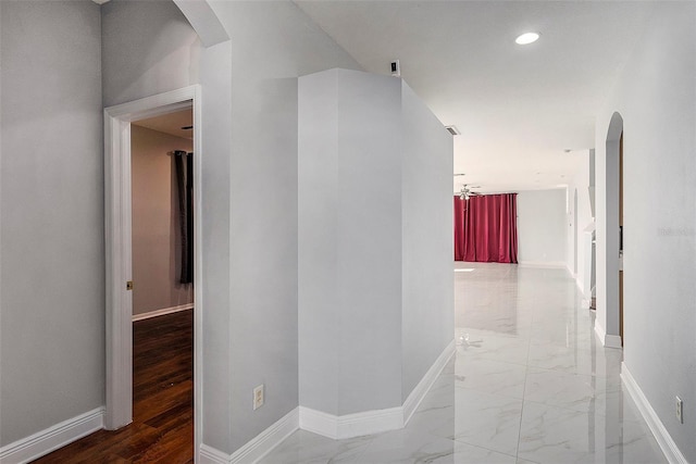 corridor with wood-type flooring