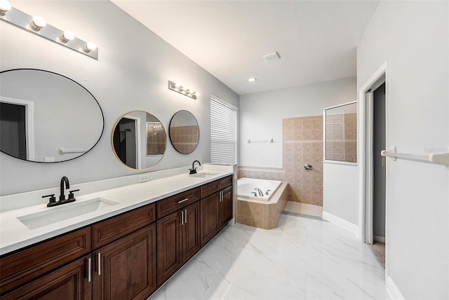 bathroom with plus walk in shower and vanity