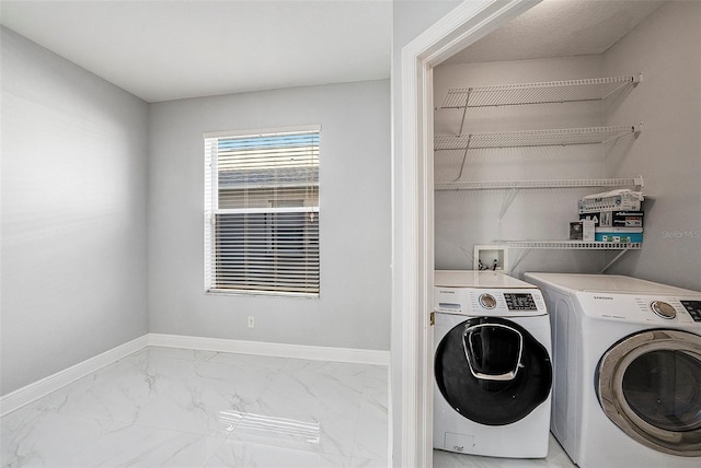 laundry room with separate washer and dryer