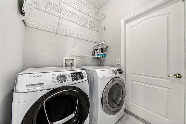 laundry area featuring separate washer and dryer