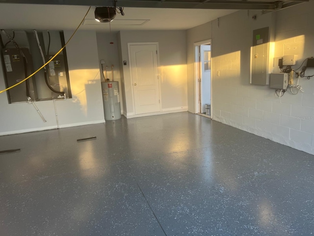 garage featuring heating unit, electric water heater, and a garage door opener