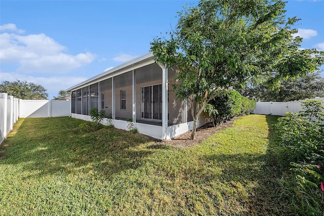 view of yard featuring a sunroom