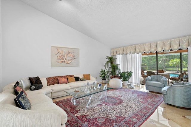 living room featuring vaulted ceiling