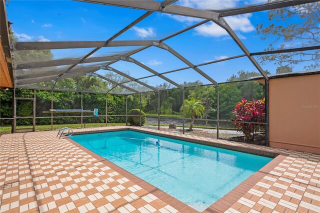 view of pool featuring a patio area and a lanai