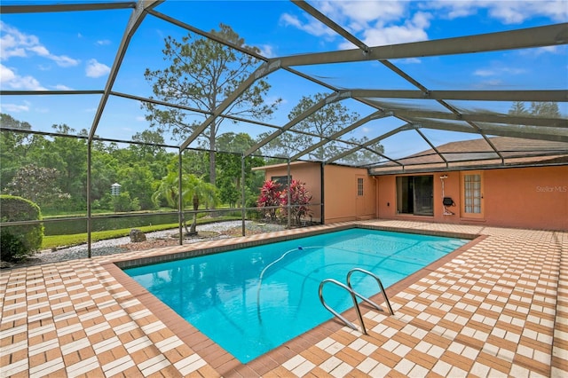 view of pool featuring a patio area and a lanai