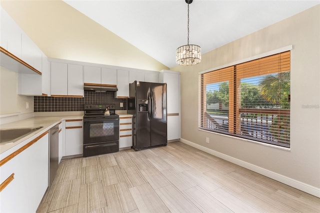 kitchen with white cabinetry, hanging light fixtures, vaulted ceiling, decorative backsplash, and black appliances