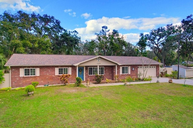 single story home featuring a garage and a front lawn