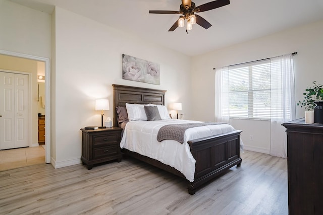 bedroom featuring light hardwood / wood-style floors and ceiling fan