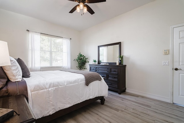 bedroom featuring light hardwood / wood-style floors and ceiling fan