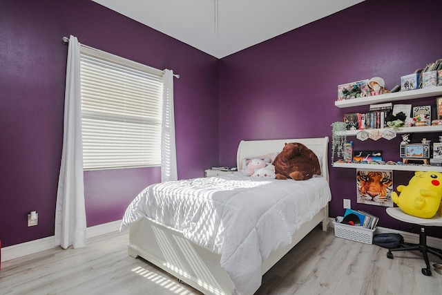 bedroom with light hardwood / wood-style floors