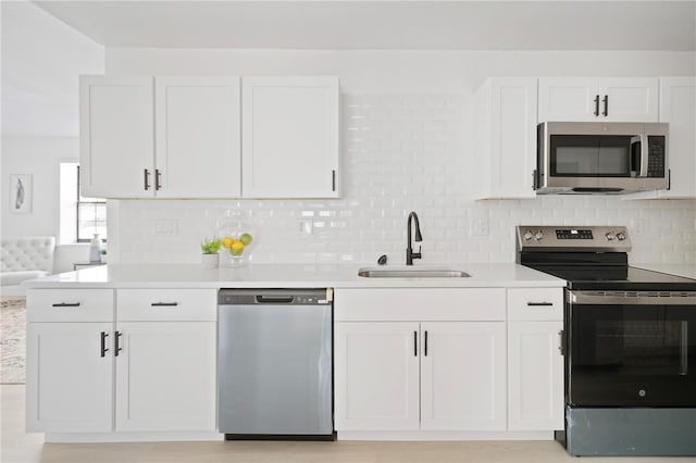 kitchen with white cabinetry and stainless steel appliances