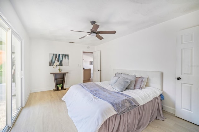 bedroom with ceiling fan and light wood-type flooring