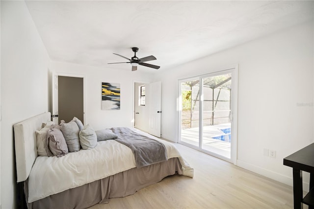 bedroom featuring access to outside, light hardwood / wood-style flooring, and ceiling fan