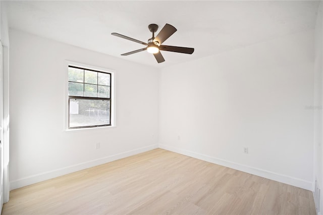 empty room featuring light wood-type flooring and ceiling fan