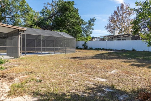 view of yard featuring a lanai