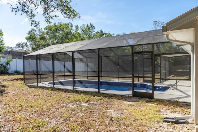 view of swimming pool with a lanai