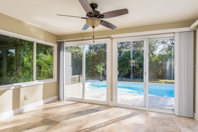 doorway to outside featuring ceiling fan