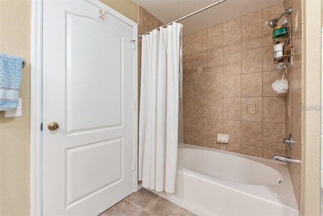 4166 Central Sarasota Pkwy Unit 521, Sarasota, FL 34238 - bathroom with shower / bath combo with shower curtain and tile patterned floors
