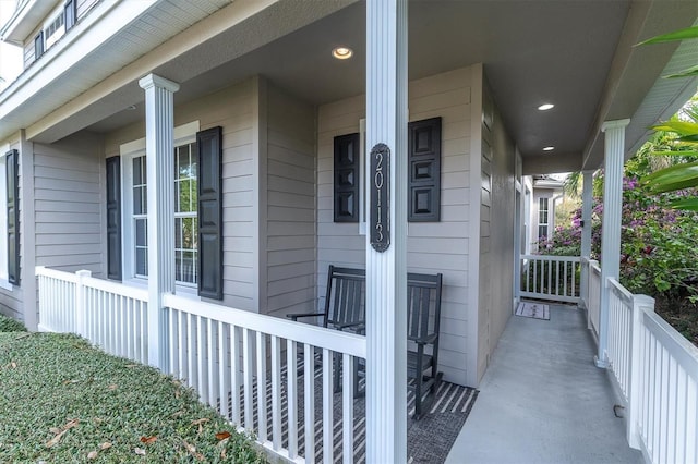 entrance to property featuring covered porch