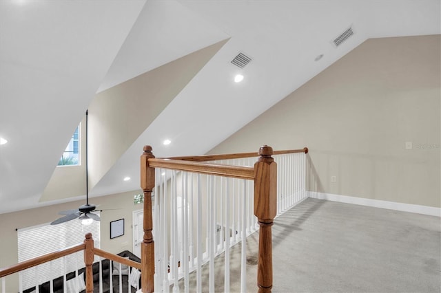 stairs featuring carpet, ceiling fan, and lofted ceiling