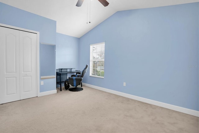 home office with light carpet, vaulted ceiling, and ceiling fan