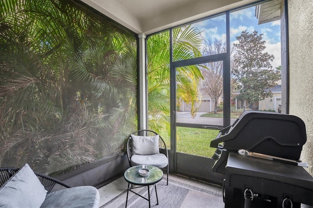 sunroom / solarium featuring a healthy amount of sunlight