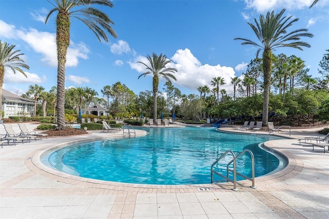 view of swimming pool with a patio