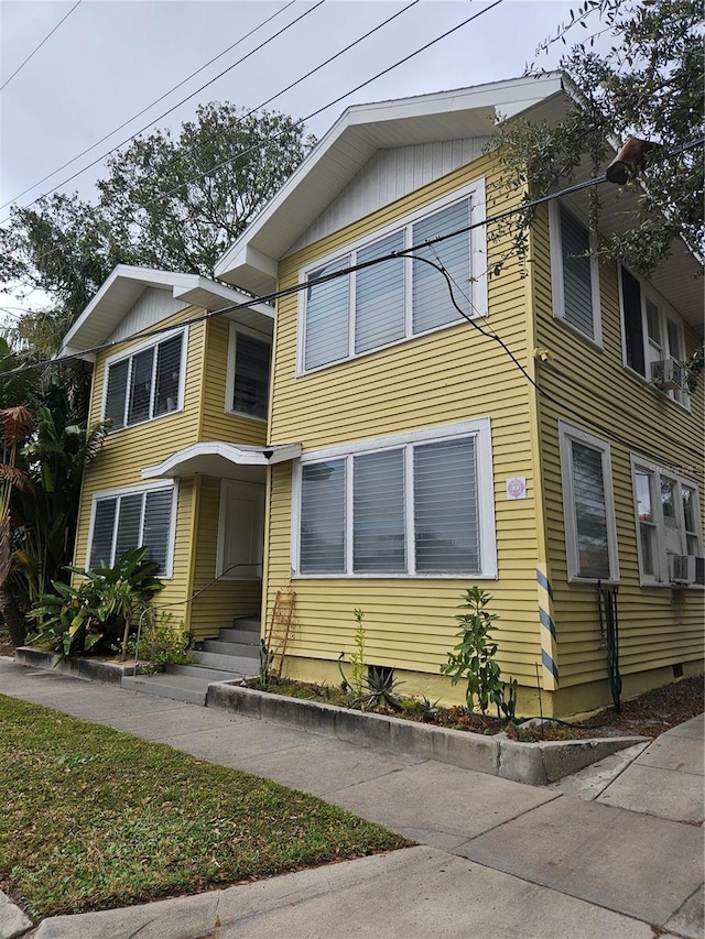 1909 W Dekle Ave, Tampa, FL 33606 - view of front facade with cooling unit and entry steps