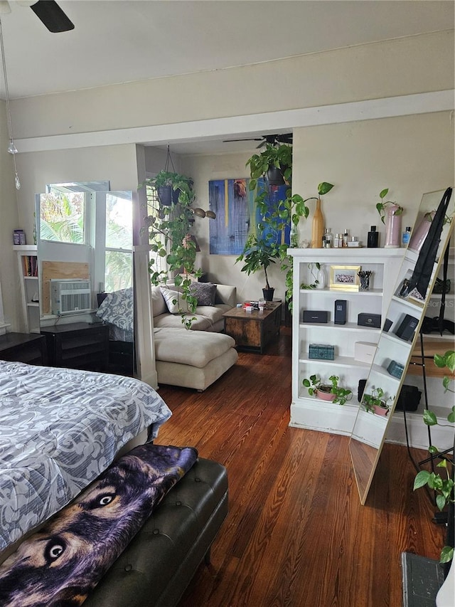 bedroom with dark hardwood / wood-style floors and ceiling fan