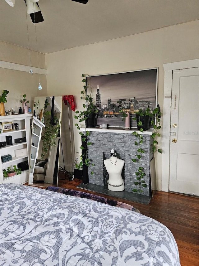 bedroom with dark hardwood / wood-style flooring