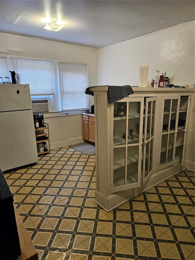 kitchen with white fridge and cooling unit