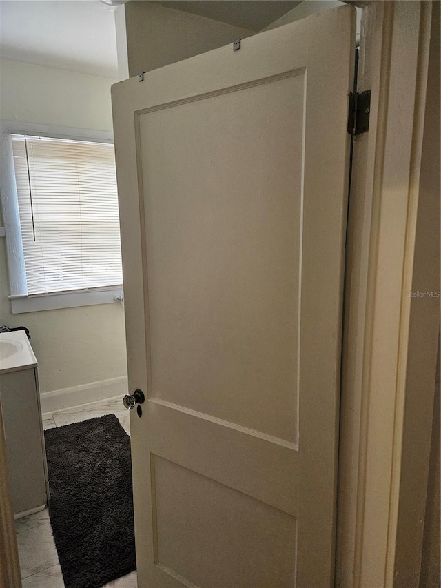 1909 W Dekle Ave, Tampa, FL 33606 - bathroom with vanity and baseboards