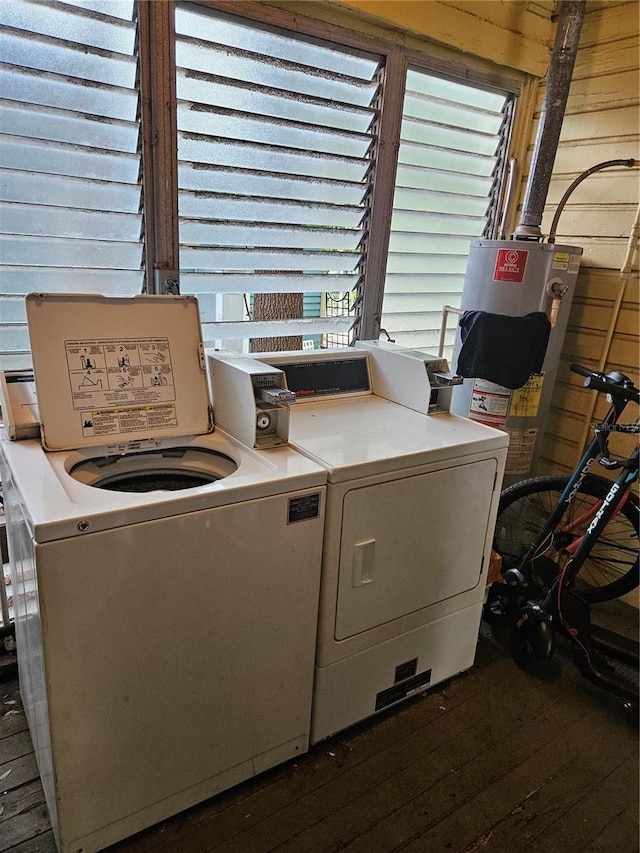 1909 W Dekle Ave, Tampa, FL 33606 - laundry area featuring washer and dryer, dark wood-style flooring, and wooden walls