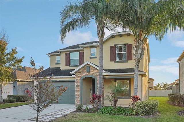 view of front of property with a garage and a front lawn