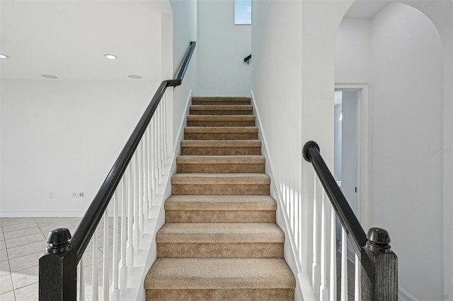 stairs with tile patterned flooring