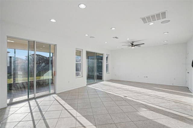 unfurnished room featuring ceiling fan and light tile patterned flooring