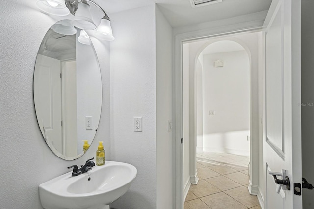 bathroom with tile patterned flooring and sink