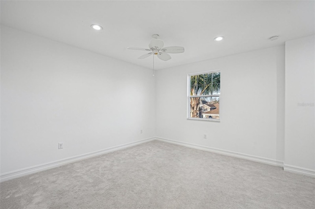 unfurnished room featuring ceiling fan and carpet floors