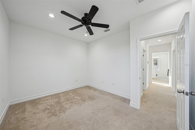 carpeted empty room featuring ceiling fan