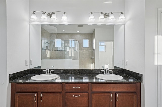 bathroom featuring vanity and walk in shower