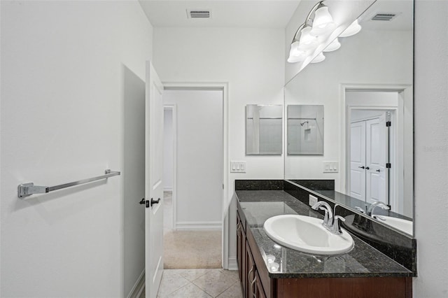 bathroom featuring tile patterned floors and vanity