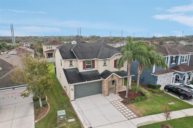 view of front of house with a garage and a front lawn