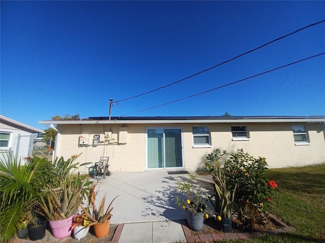 back of property featuring a patio