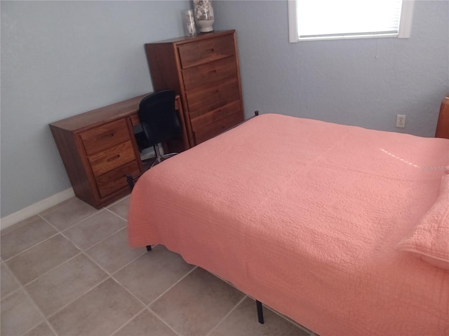 bedroom featuring light tile patterned flooring