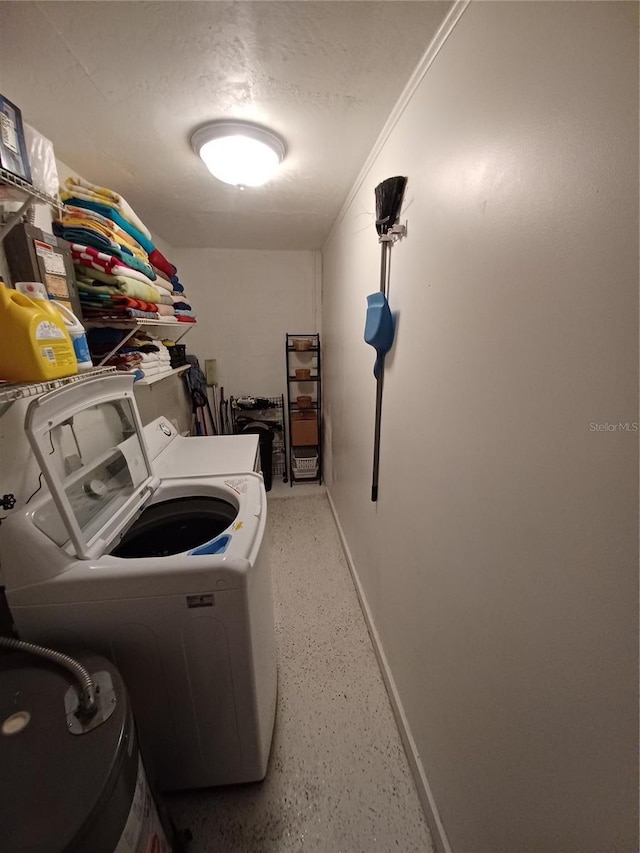 laundry room featuring washer and clothes dryer and ornamental molding