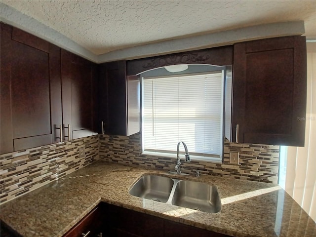 kitchen featuring decorative backsplash and dark brown cabinets