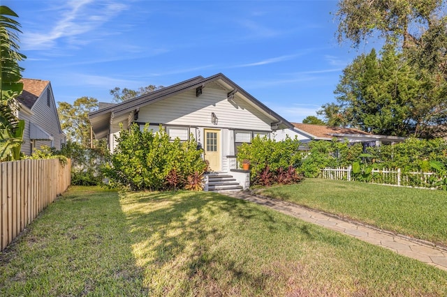 view of front of property with a front lawn