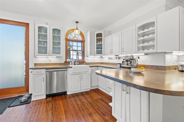 kitchen with dark hardwood / wood-style flooring, stainless steel dishwasher, sink, white cabinets, and hanging light fixtures